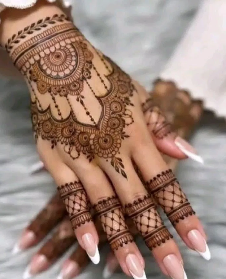 Aesthetic Bridal Back Hand Mehndi Design with Bel, Gol Tikki and Flowers for Diwali