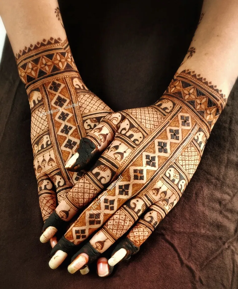 Heavy Aesthetic Royal Back Hand Mehndi Design with Figures and Hearts