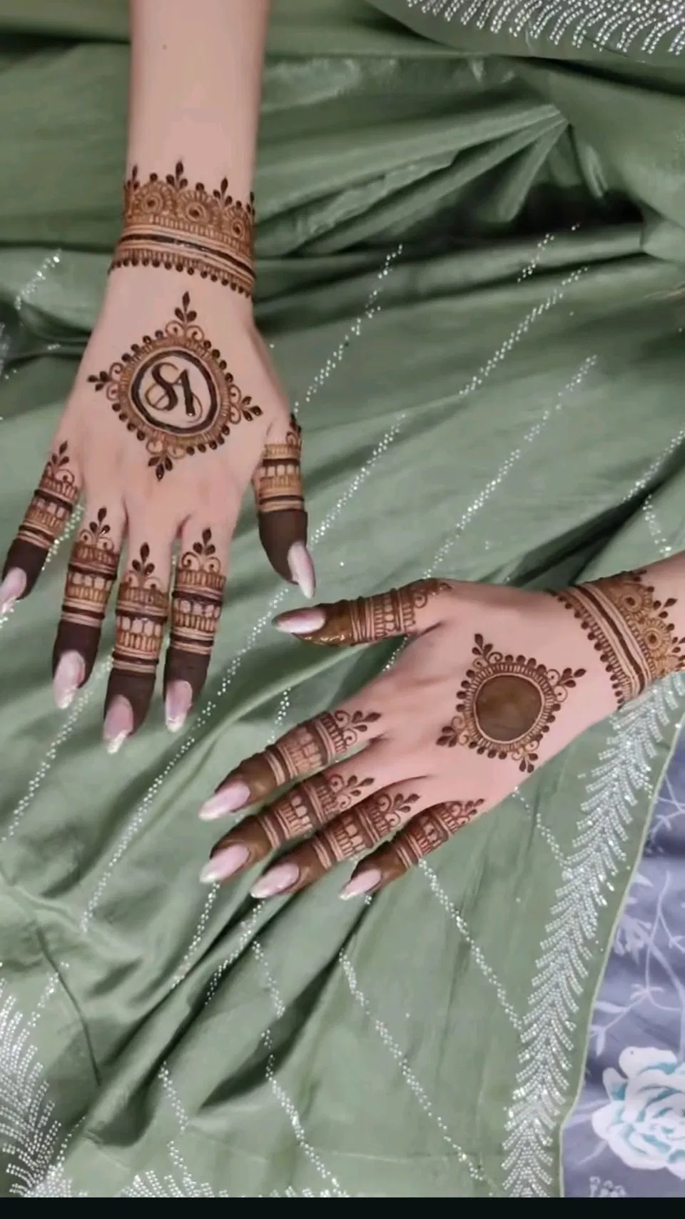 Aesthetic Minimal Back Hand Mehndi Design with Gol Tikki, Jaal and Hidden Name for Engagement (3)