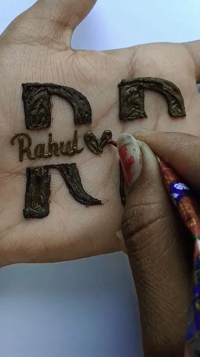 Back Hand Mehndi Design with Figures, Jaal and Hidden Name