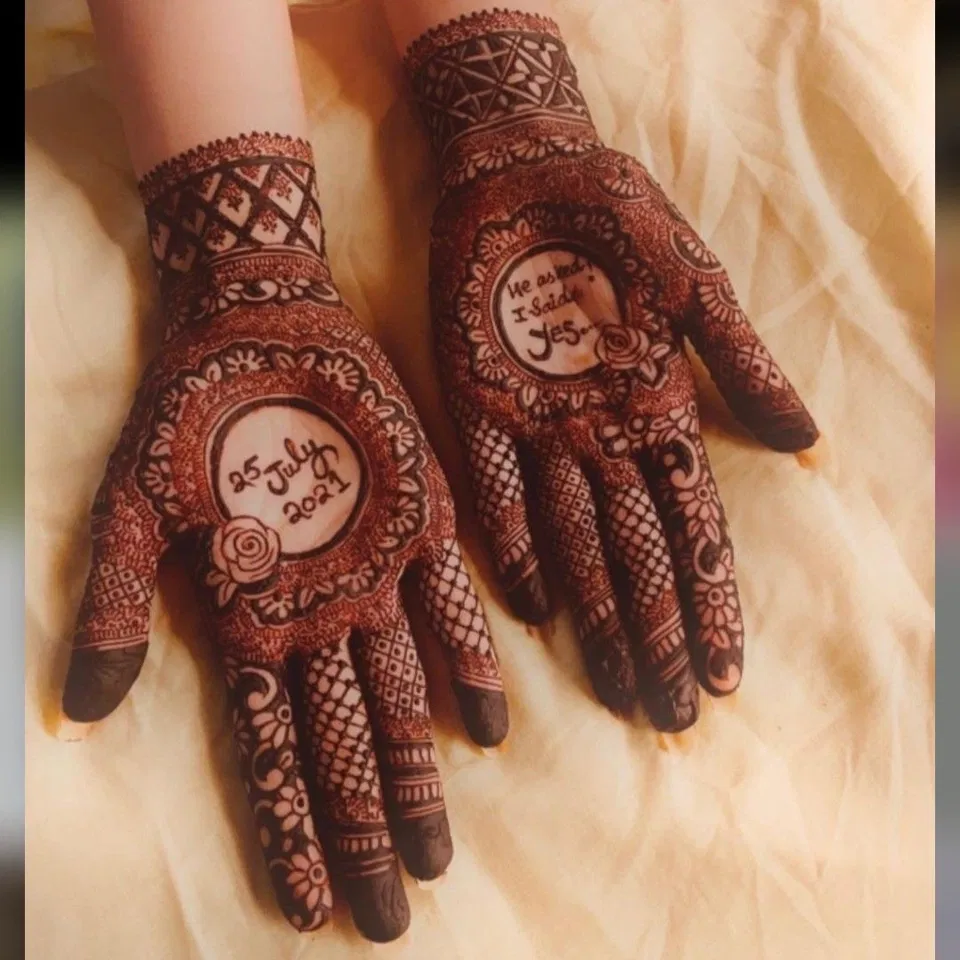Bridal Front Hand Mehndi Design with Gol Tikki, Deity and Figures for Engagement
