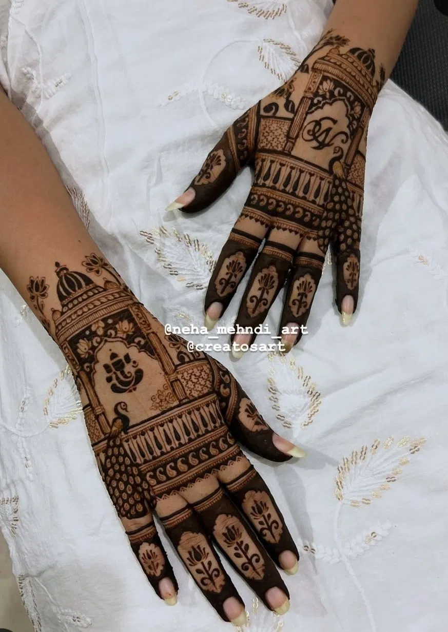 Stylish Back Hand Mehndi Design with Jaal and Peacock