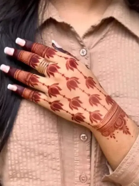 aesthetic simple flower back hand mehndi design