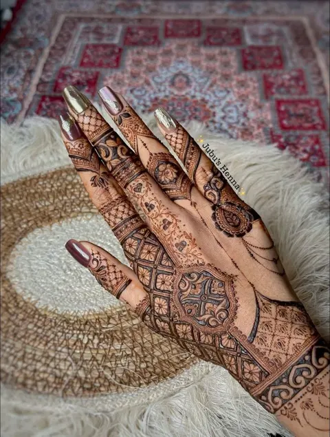 aesthetic royal back hand mehndi design