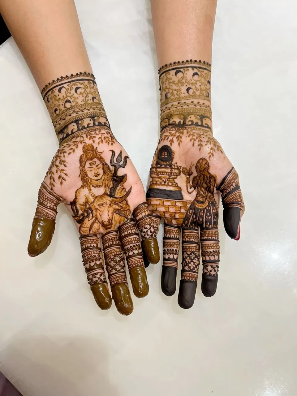 Bridal Simple Back Hand Mehndi Design with Figures for Shivratri