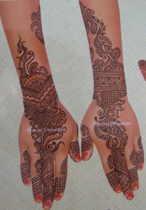 arabic peacock back hand mehndi design