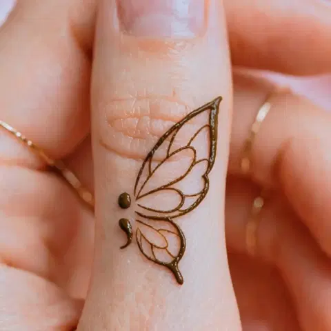 aesthetic minimal butterfly back hand mehndi design