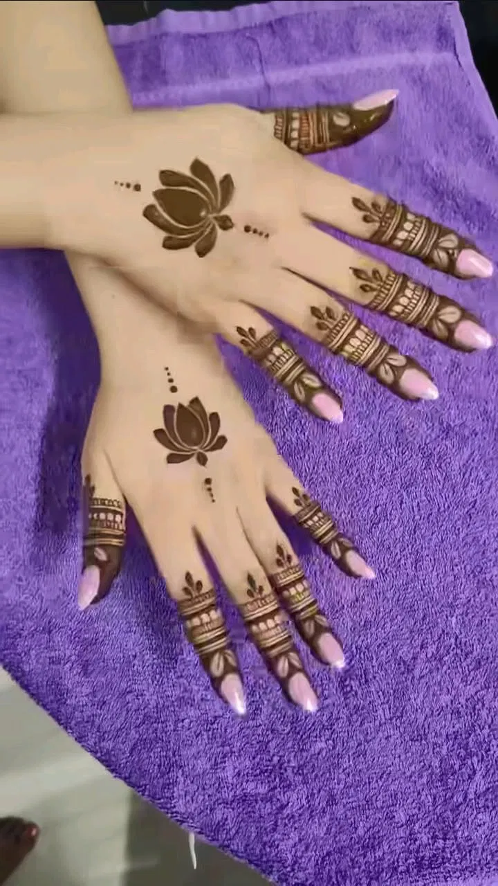 Aesthetic Simple Back Hand Mehndi Design with Gol Tikki, Jaal and Lotus (4)