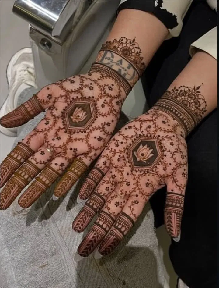 Aesthetic Bridal Back Hand Mehndi Design with Bel and Lotus
