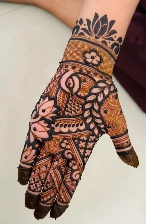 Aesthetic Bridal Arm Mehndi Design with Lotus and Peacock