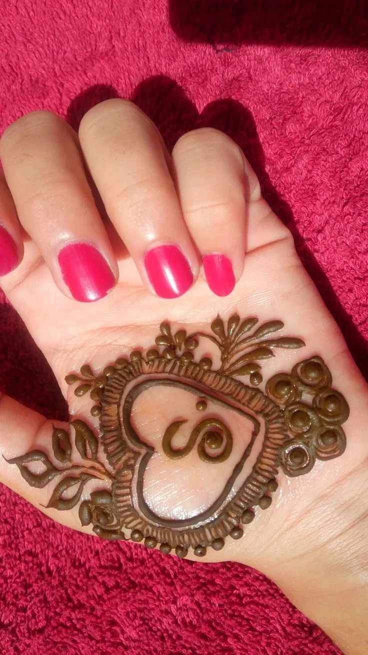 Stylish Back Hand Mehndi Design with Hearts and Hidden Name