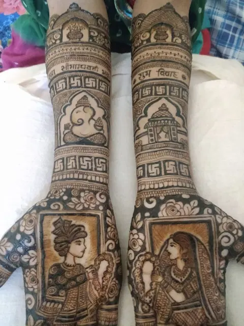 bridal deity back hand mehndi design
