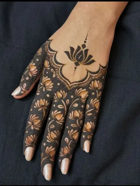 aesthetic minimal lotus back hand mehndi design