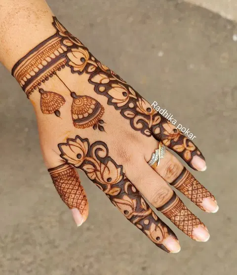 aesthetic minimal lotus back hand mehndi design