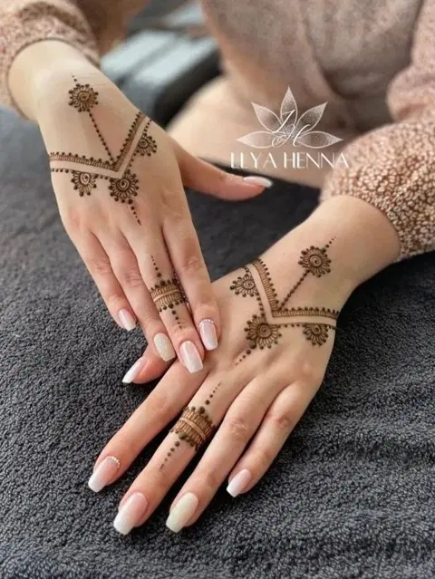 aesthetic minimal lotus arm mehndi design