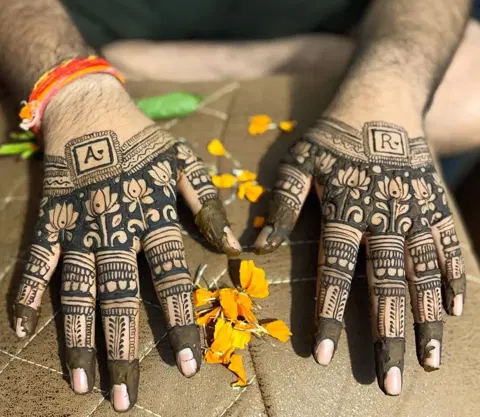 bridal simple deity back hand mehndi design