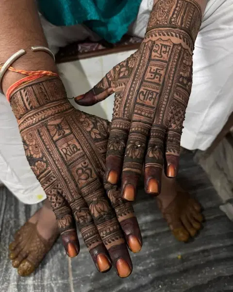 bridal royal deity back hand mehndi design