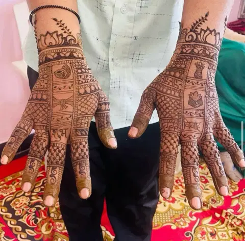 bridal deity back hand mehndi design