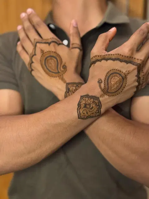 bridal deity arm mehndi design