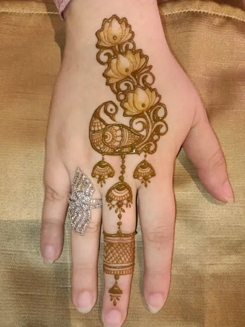 minimal simple lotus back hand mehndi design