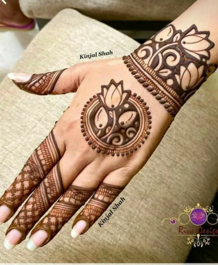 Aesthetic Minimal Back Hand Mehndi Design with Gol Tikki and Lotus for Diwali (11)