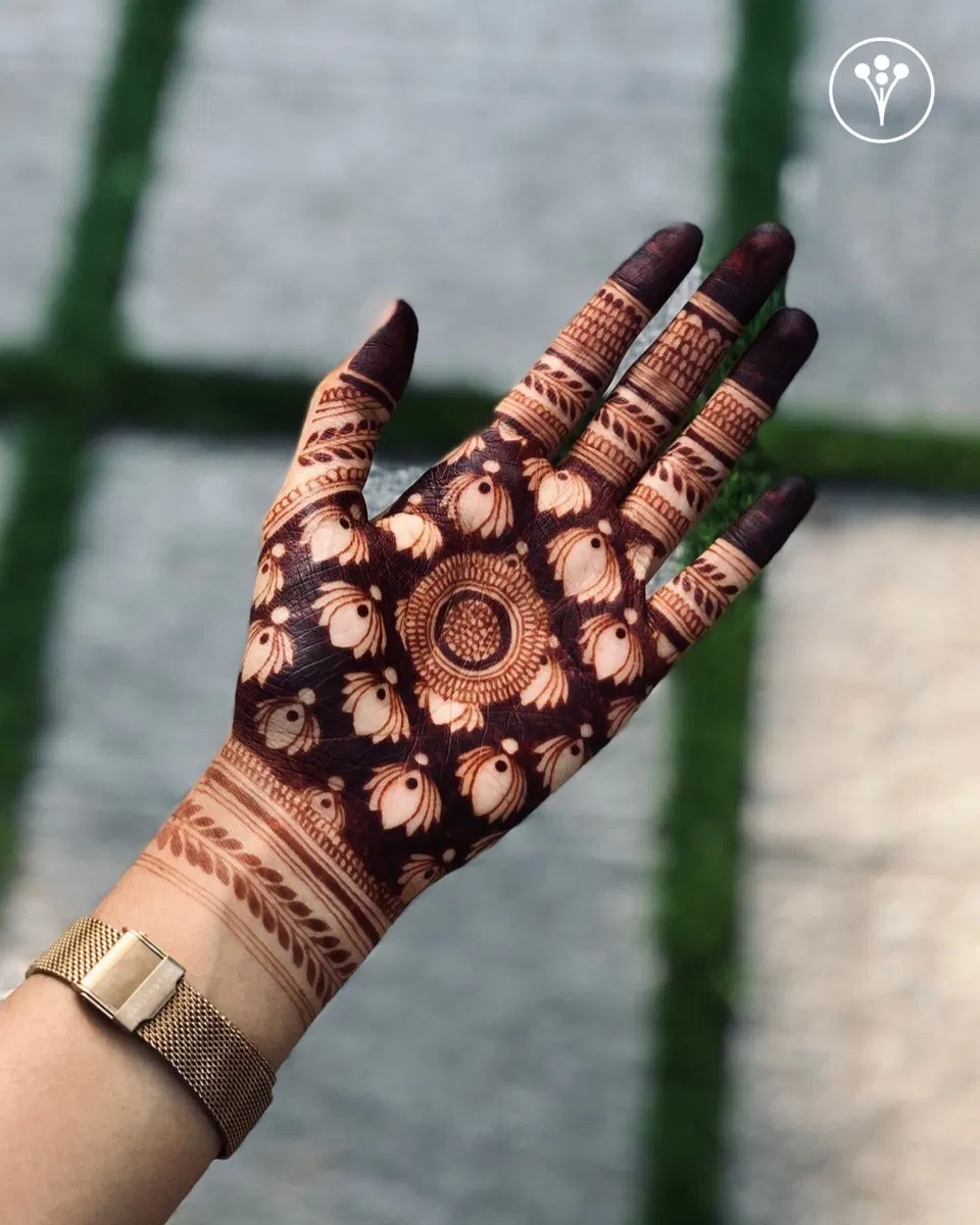 Aesthetic Bridal Back Hand Mehndi Design with Gol Tikki and Lotus for Raksha Bandhan (7)