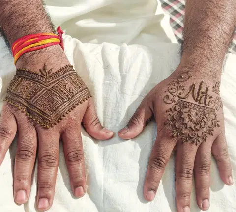 simple deity back hand mehndi design