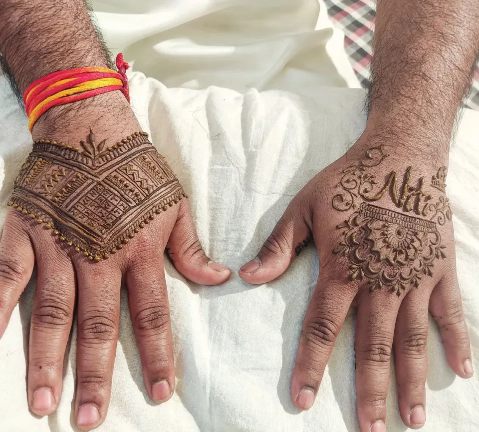 Simple Back Hand Mehndi Design with Deity and Figures