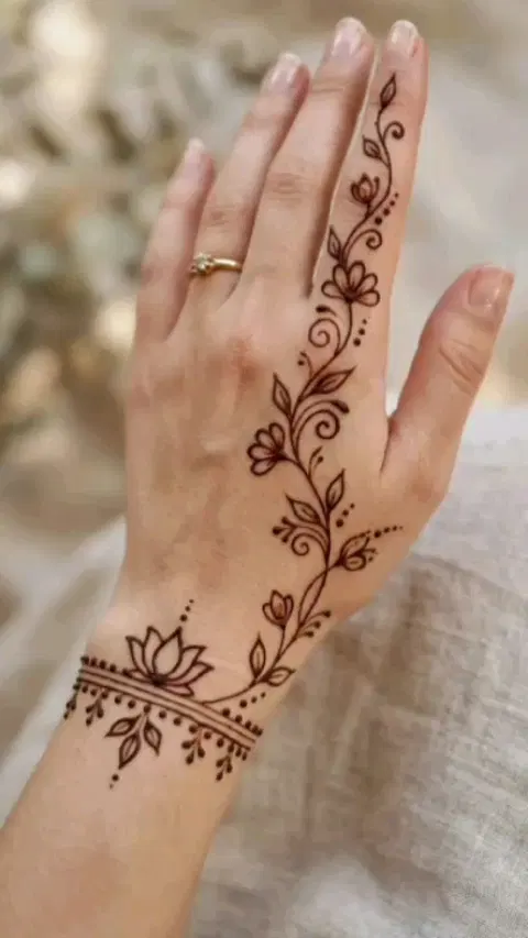 aesthetic bridal flower back hand mehndi design