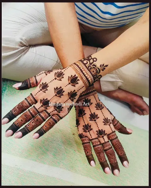 aesthetic minimal lotus back hand mehndi design