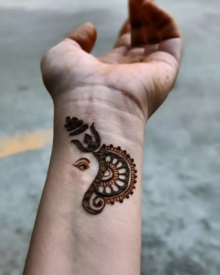 Simple Arm Mehndi Design with Deity and Peacock