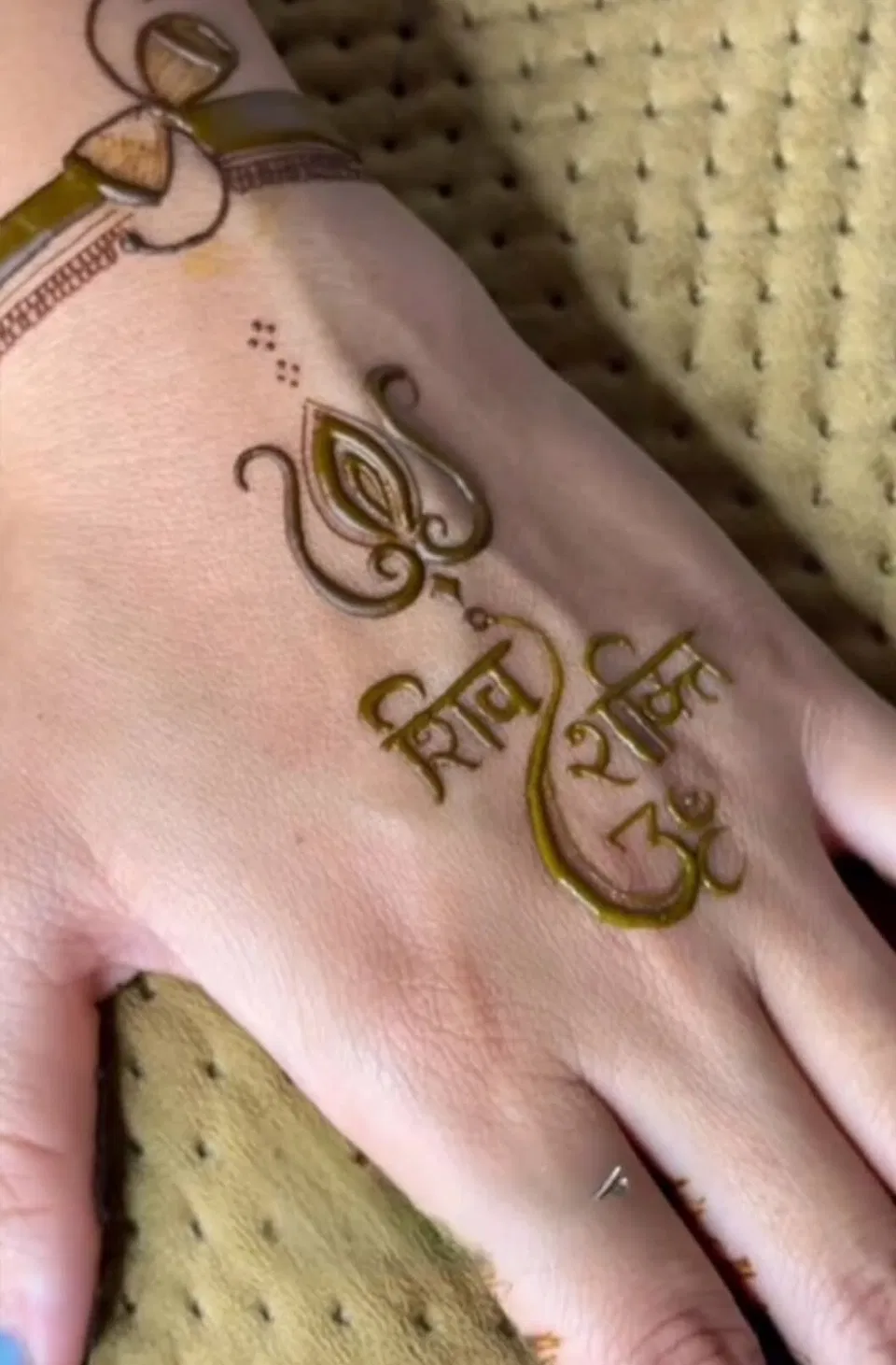 Simple Back Hand Mehndi Design with Deity and Hearts