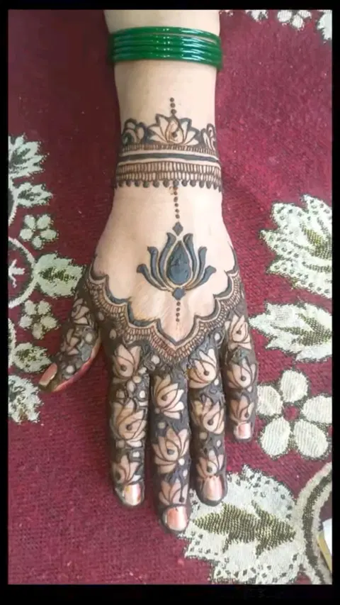 aesthetic bridal lotus back hand mehndi design