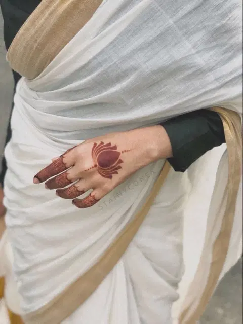 minimal simple lotus back hand mehndi design