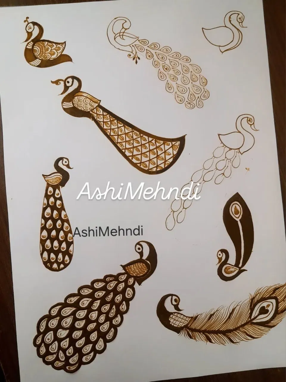 Back Hand Mehndi Design with Hearts and Peacock