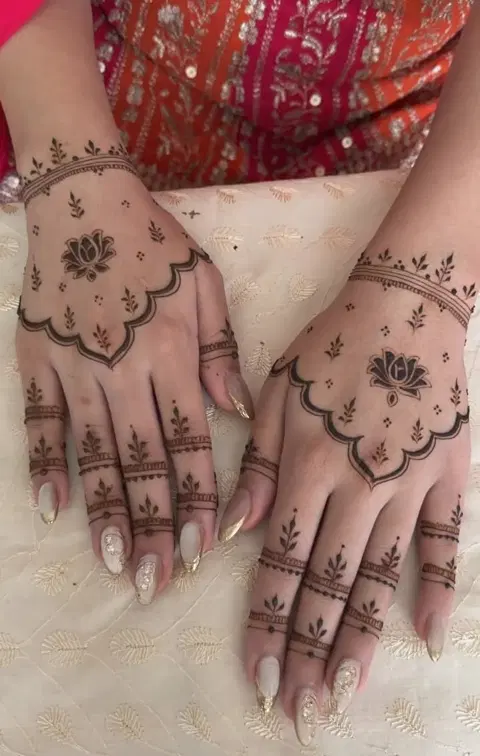 aesthetic simple lotus back hand mehndi design