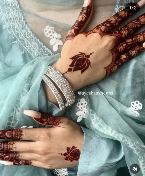 aesthetic simple lotus back hand mehndi design