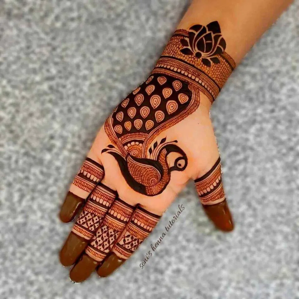 Simple Back Hand Mehndi Design with Peacock for Teej