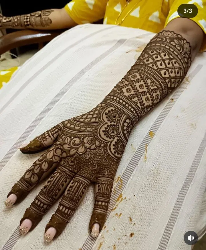 Bridal Arm Mehndi Design with Figures and Jaal