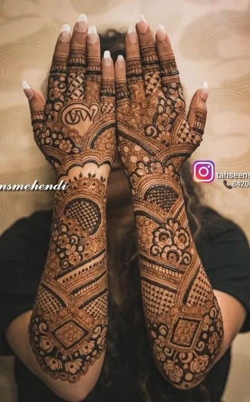 Bridal Back Hand Mehndi Design with Figures, Hearts and Jaal