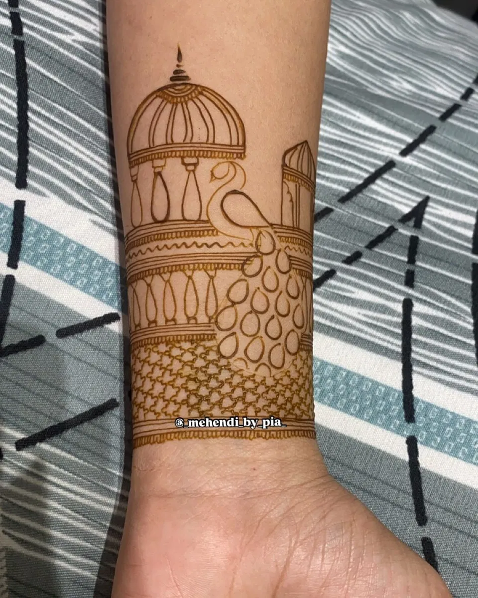 Bridal Indian Arm Mehndi Design with Gol Tikki and Peacock