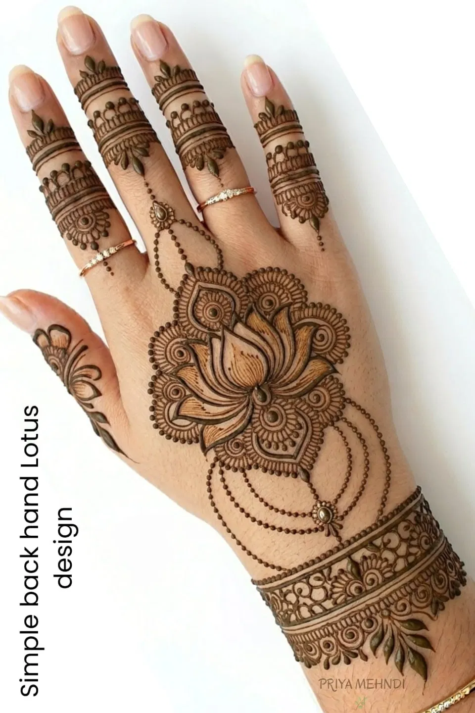 Bridal Minimal Back Hand Mehndi Design with Lotus