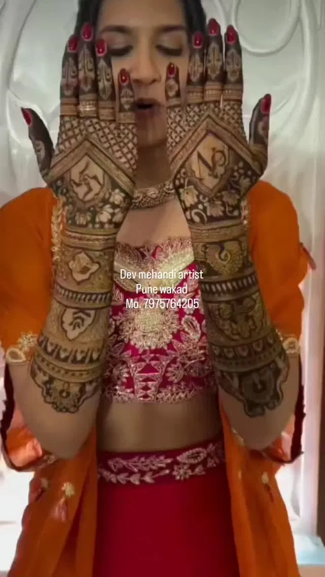 Back Hand Mehndi Design with Figures, Hearts and Lotus