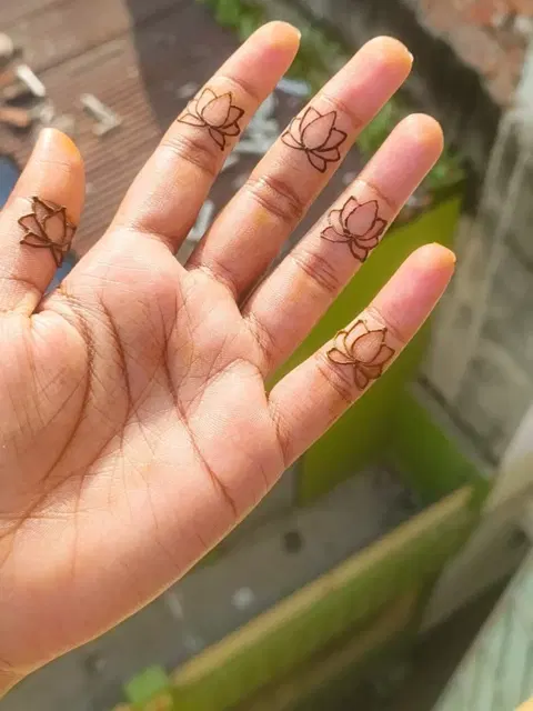 aesthetic simple lotus finger mehndi design