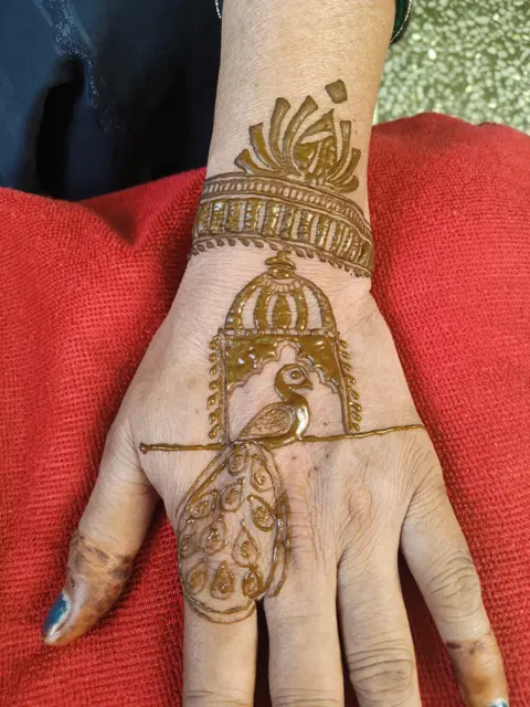 simple peacock full hand mehndi design