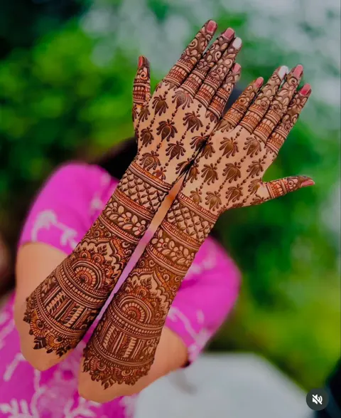 bridal indian figure back hand mehndi design