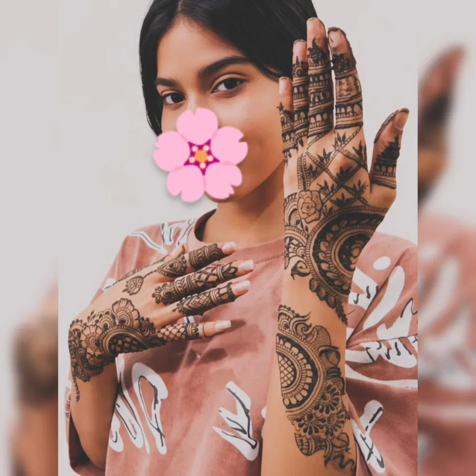 Stylish Back Hand Mehndi Design with Hearts and Jaal