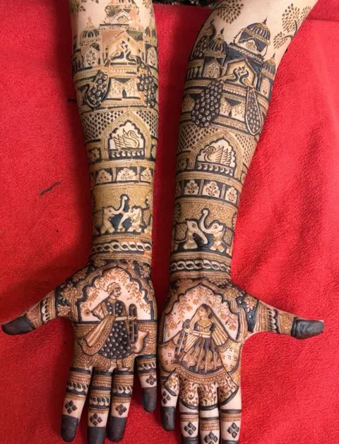 figure full hand mehndi design