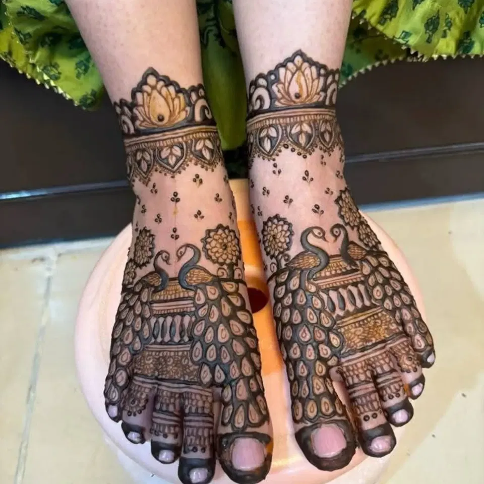 Bridal Foot Mehndi Design with Figures, Lotus and Peacock