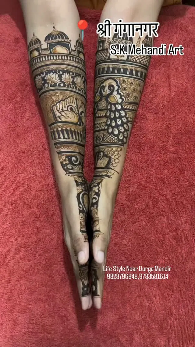 Bridal Back Hand Mehndi Design with Figures, Hearts and Peacock